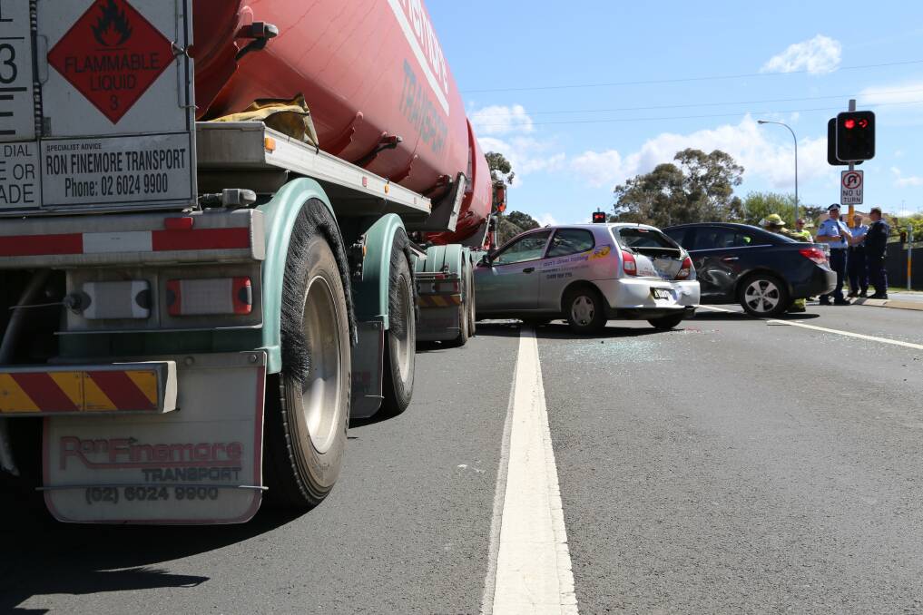 Five vehicles, including a fuel tanker, were damaged in a crash on the intersection of Canberra Avenue and Tharwa Road this afternoon. Photo: Kim Pham.