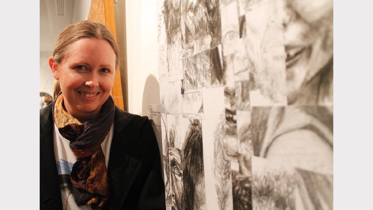 Debra Boyd-Goggin with her winning graphite and charcoal drawing 'Faces'.