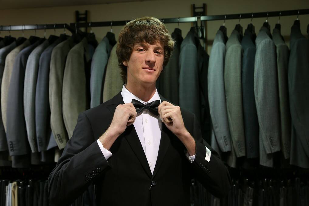 Queanbeyan High School student Norman Lembit prepares for the year 12 formal.