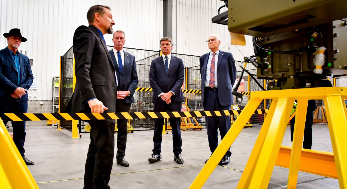 Angus Taylor, Jim Molan and Jerry Nockles tour Electro Optic Systems with senior vice president of global production and supply chain, Dr Warwick Holloway. Picture: Elesa Kurtz