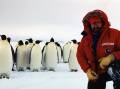Prof Tony Haymet with a colony of penguins in Antarctica