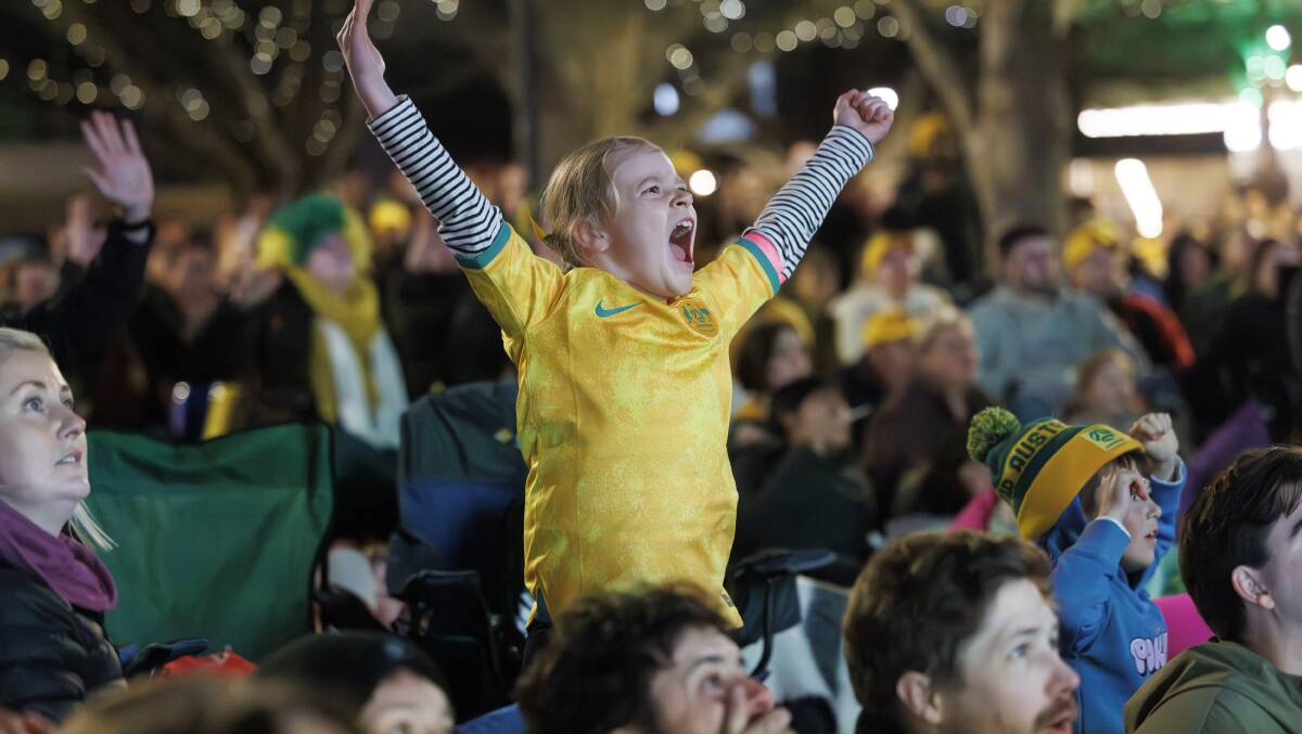 Matildas fan Addison Irvine watches the game at Garema Place. Picture by Keegan Carroll