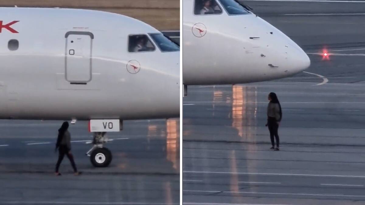 A passenger at Canberra Airport was filmed unlawfully walking on the tarmac on Wednesday. Picture screenshot Twitter/@TheFullDen