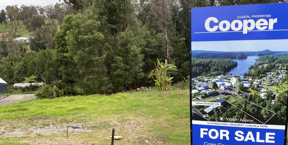 For sale signs have cropped up throughout Conjola Park, in front of vacant blocks and new homes rebuilt following bushfire damage. Picture by Glenn Ellard.