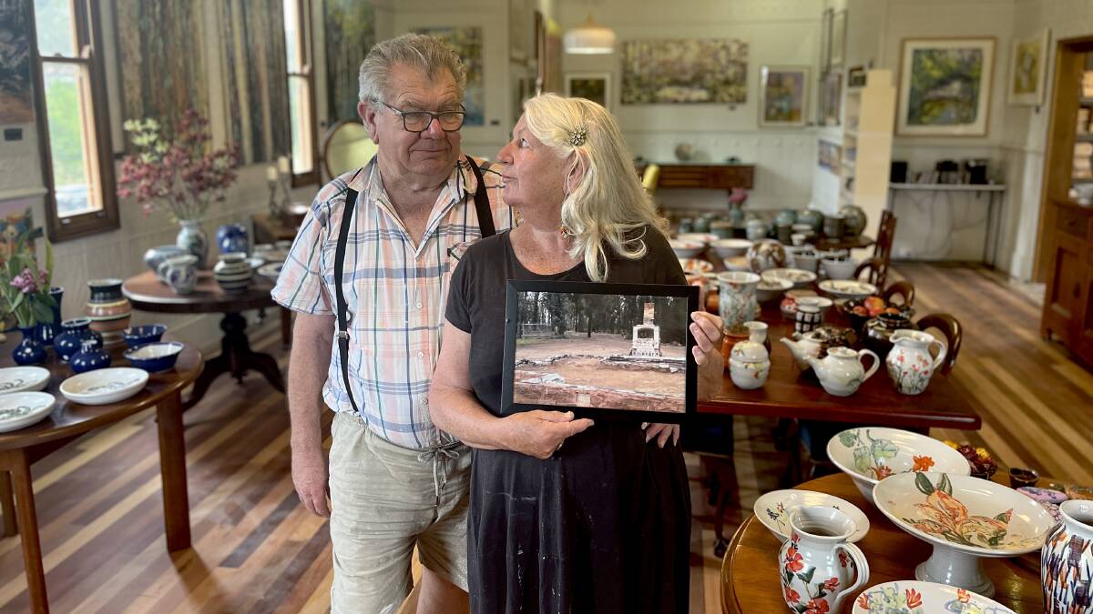 Peter and Vanessa Williams inside the rebuilt church. Vanessa clutches on to a photograph of all that remained after the Black Summer fire. Picture by Jimmy Parker Peter and Vanessa Williams inside the rebuilt church. Vanessa clutches on to a photograph of all that remained after the Black Summer fire. Picture by Jimmy Parker