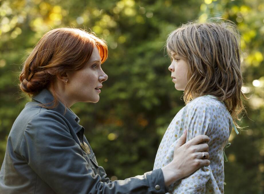 CLASSIC REVISITED: This image released by Disney shows Bryce Dallas Howard, left, and Oakes Fegley in a scene from "Pete's Dragon", a remake of the live-action animated family favourite from 1977.