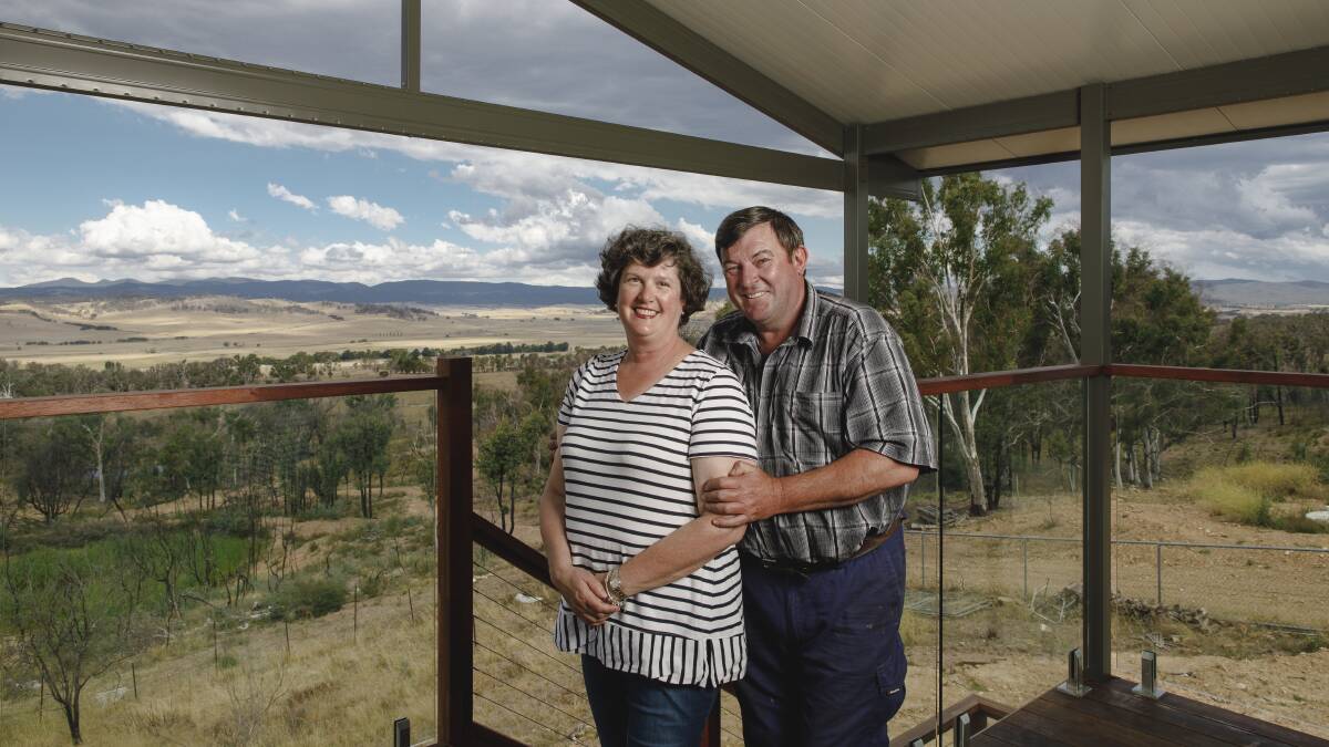 MOVING ON: Vanessa and Kevin Lindley enjoying the view from their new home at Carwoola. Photo: Sitthixay Ditthavong.