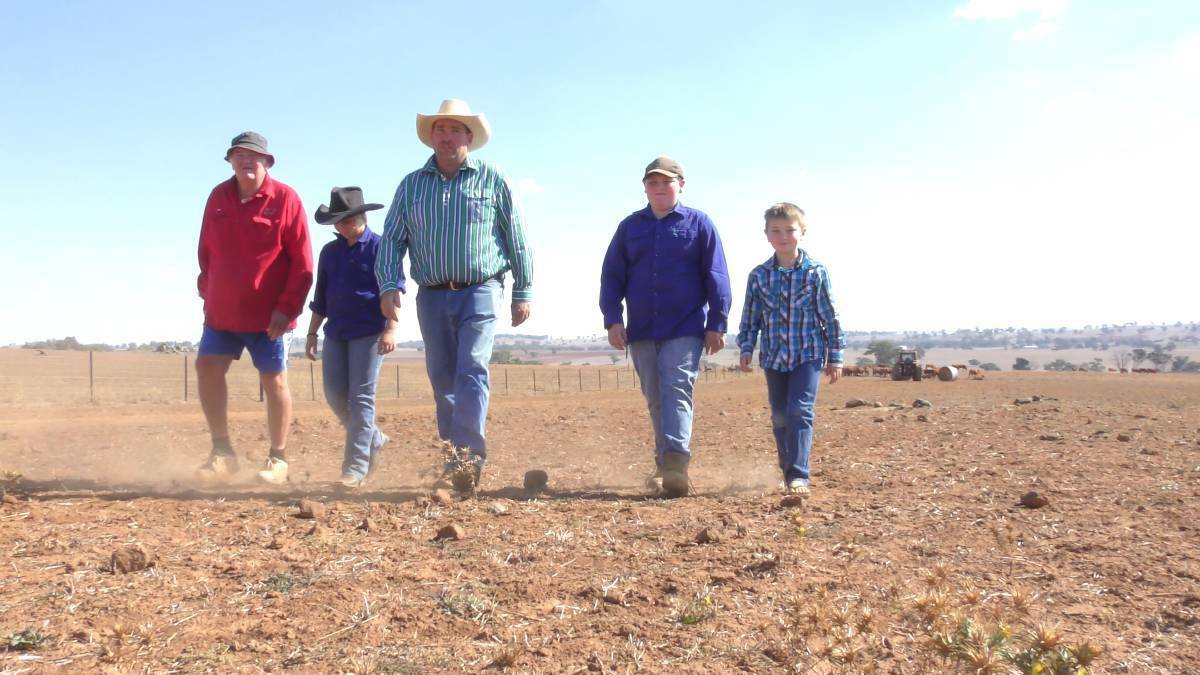 FIGHT OF THEIR LIFE: John, Brooke, Chris, Thomas and Jack Haycock on their farm at Yeoval, which has been in their family for six generations. 