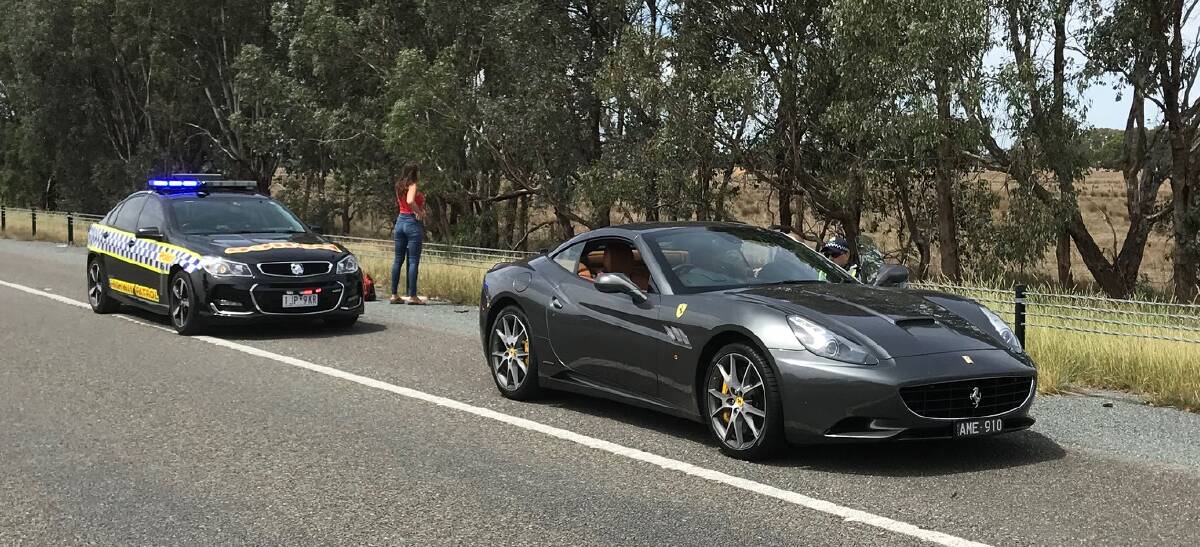 DOUBLE THE SPEED: The black Ferrari was pulled over by Wangaratta Highway Patrol officers near the Greta Road overpass, following calls to triple-zero.