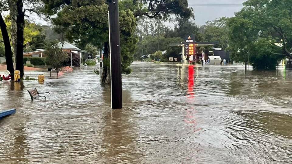 Floodwaters over the main street of Mogo in December 2021. Picture: Supplied
