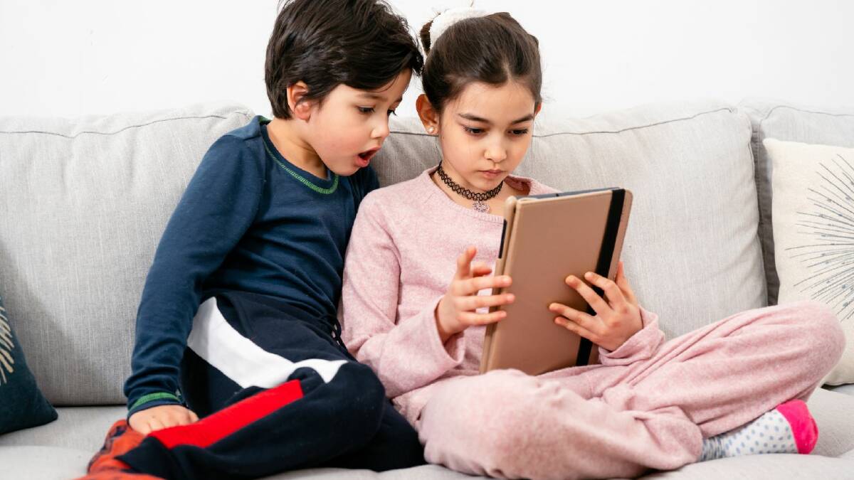 A file picture of children watching an iPad. Picture from Canva.