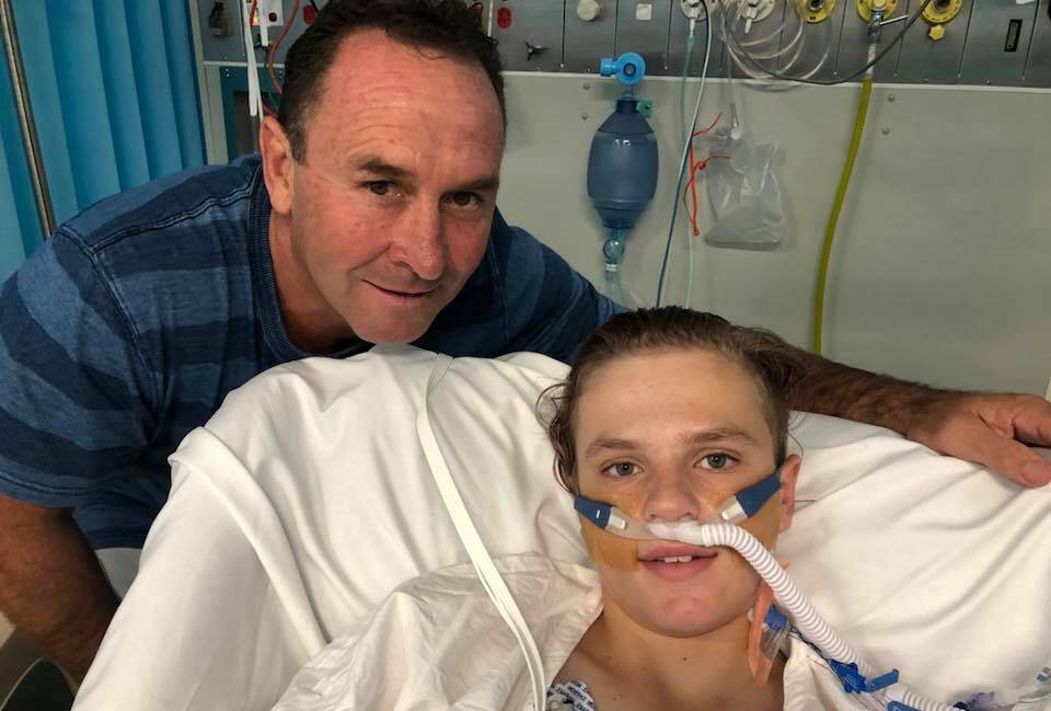 TJ with Canberra Raiders coach Ricky Stuart who dropped in to show his support during TJ's recovery. Photo: Supplied