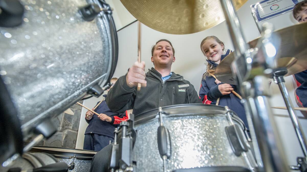 Talented musician Rory Turner-Quirk (pictured with student Isabelle Howarth) is the Googong Anglican School's new music teacher.  Photo: Karleen Minney