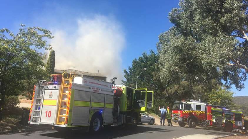 The fire burns off Ullamulla Crescent in Karabar as emergency services attend the scene. Photo: Julieanne Pearl