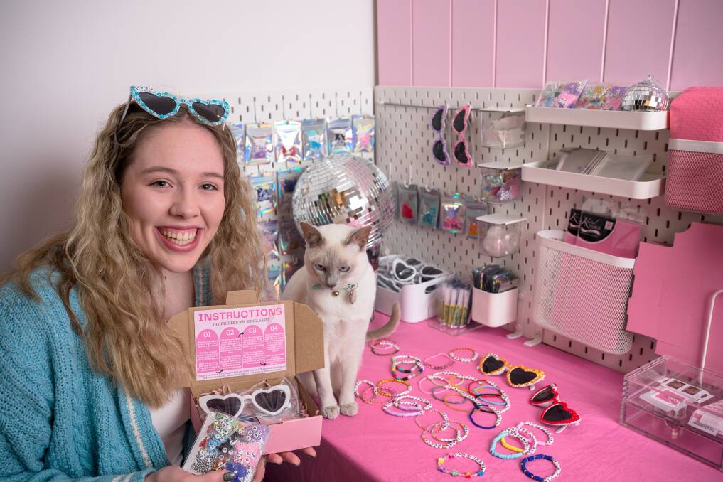 Hannah Murrells, pictured with her cat Frankie, has started an Etsy store selling Taylor Swift friendhship bracelet kits. Picture by Sitthixay Ditthavong
