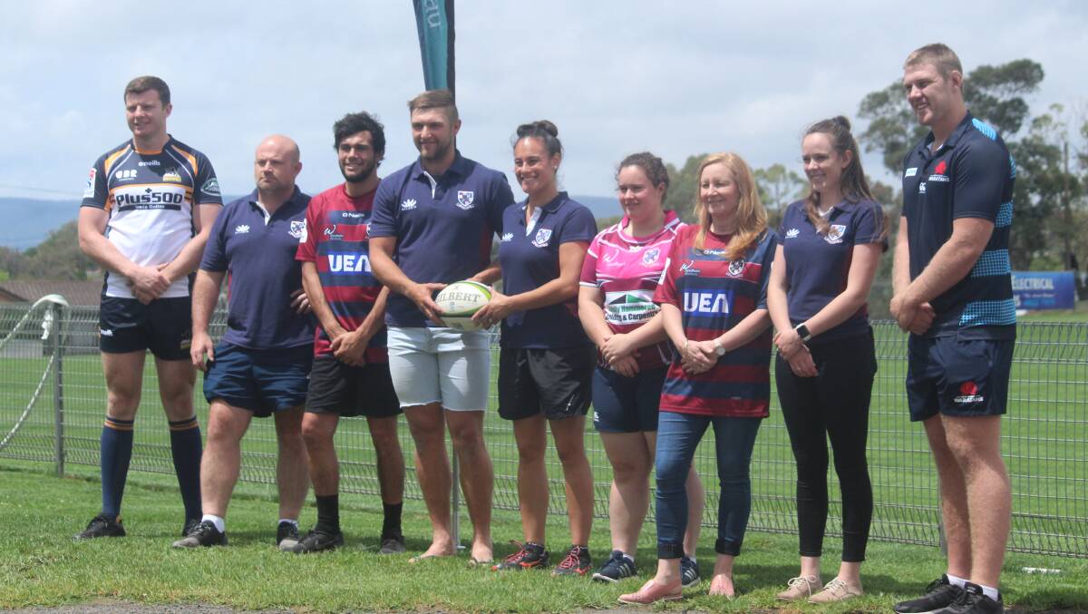 Welcome: Murray Douglas (far left) and Tom Staniforth (far right) are welcomed to Goulburn's Workers Arena by members of the Goulburn Rugby Union Football Club. Photo: Zac Lowe.
