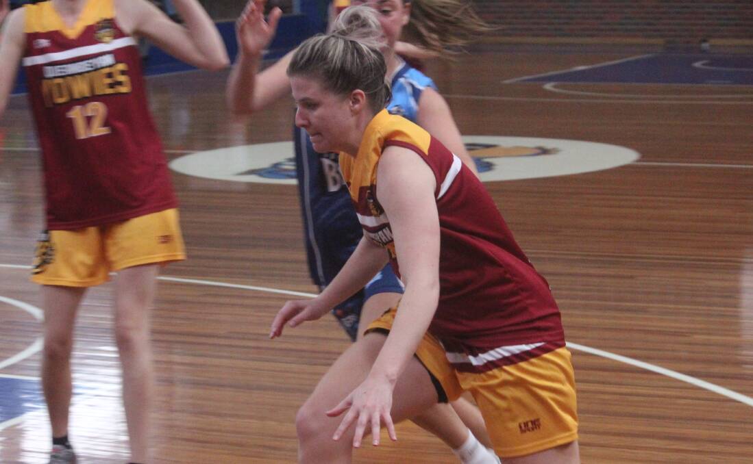 Breaking defeance: Julie Ticehurst makes a scoring attempt during Queanbeyan's 52-59 win over Goulburn at the Goulburn Basketball Stadium on Saturday afternoon. Photo: Zac Lowe.