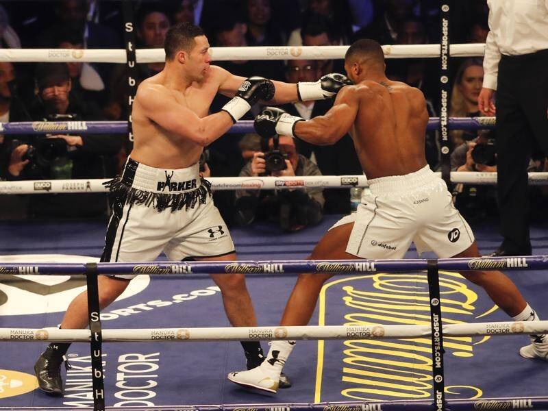 Joseph Parker (l) hopes to line up a title rematch against Anthony Joshua (r) by beating Joe Joyce. (AP PHOTO)