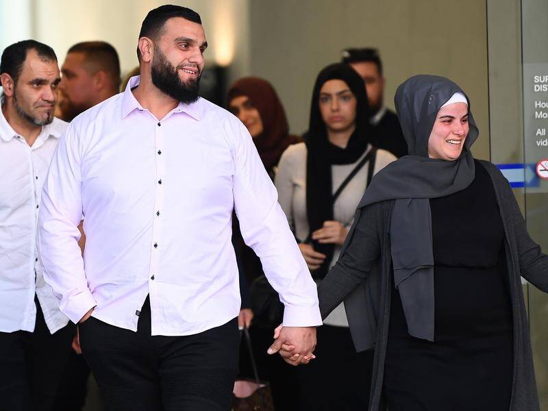 A jury found Osman El-Houli (centre) not guilty of attempting to possess illegally imported drugs. (Jono Searle/AAP PHOTOS)