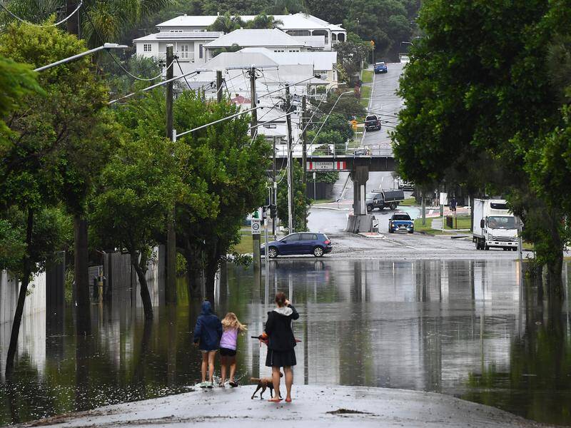 Homes are without power and many schools remain closed as the clean-up from an ex-cyclone begins. Photo: Jono Searle/AAP PHOTOS