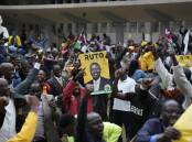 Supporters of William Ruto celebrate his win in the tight presidential election race. (AP PHOTO)