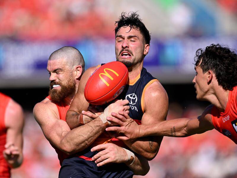 Chris Scott has objected to the AFL admitting an umpire error in this clash involving Izak Rankine. Photo: Dave Hunt/AAP PHOTOS Chris Scott has objected to the AFL admitting an umpire error in this clash involving Izak Rankine. Photo: Dave Hunt/AAP PHOTOS