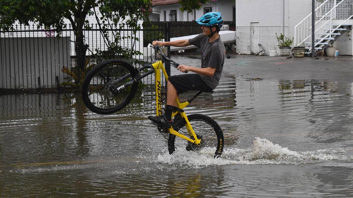 Flooding in Newmarket in Brisbane following heavy rain brought by ex-cyclone Alfred. (Jono Searle/AAP PHOTOS)