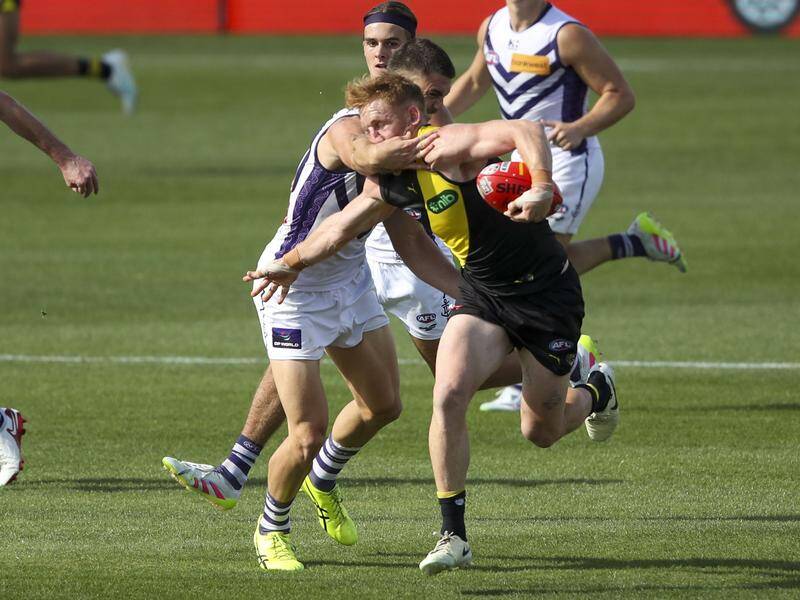 The AFL Tribunal has ruled this incident warrants a three-game ban for Fremantle's Patrick Voss. Photo: Matt Turner/AAP PHOTOS The AFL Tribunal has ruled this incident warrants a three-game ban for Fremantle's Patrick Voss. Photo: Matt Turner/AAP PHOTOS