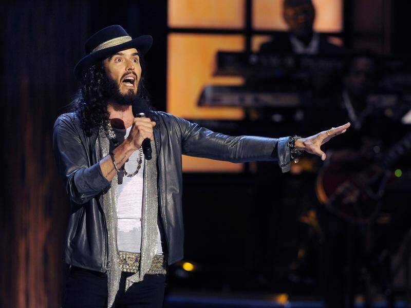 Russell Brand says his baptism was "an opportunity to leave the past behind and be reborn". (AP PHOTO)