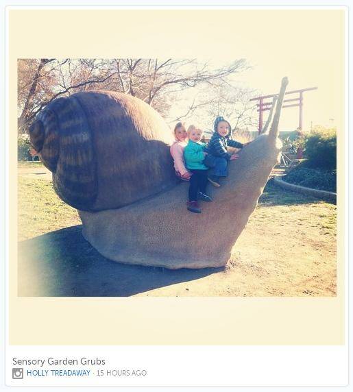 Local kids with Queanbeyan's beloved Morty the Snail. Photo: Instagram / @hollywoops.