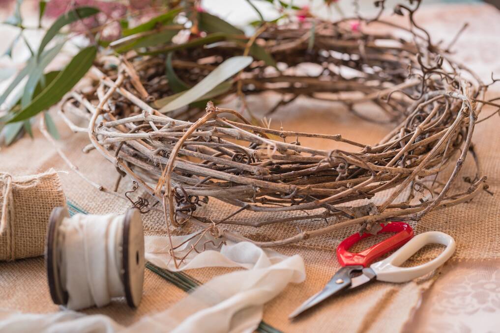 What you’ll need: Scissors, a wreath base, pliable wire, foliage, flowers and ribbon.