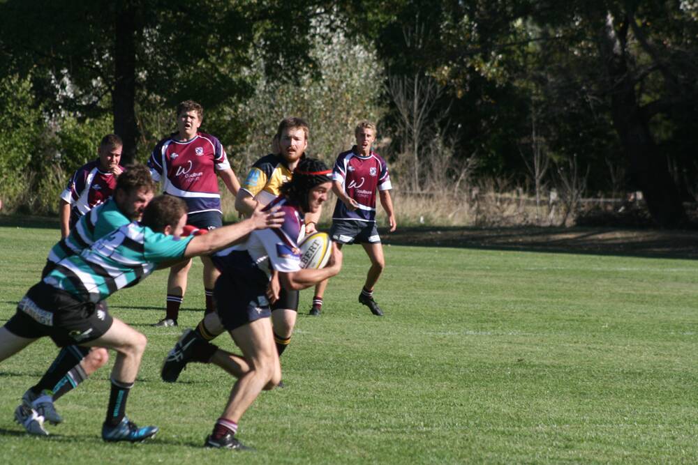 Line break: Goulburn Dirty Reds in action during their thumping of the Queanbeyan Whites. Photos: Pete Oliver. 