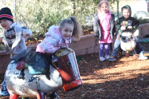 Myah Staniforth and friends enjoy the new outdoor play area at the Campbell Street Childcare Centre. 