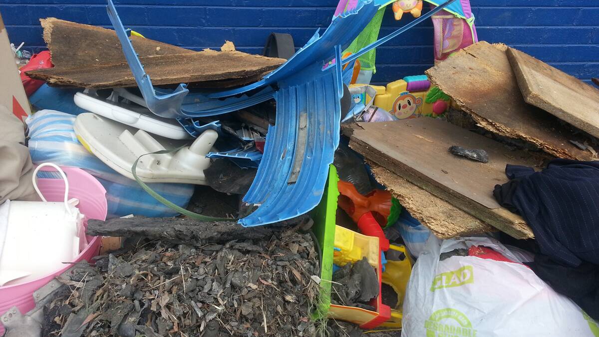 This pile of garbage, burnt metal and timber was recently left dumped outside the Queanbeyan Salvos' back entrance. 